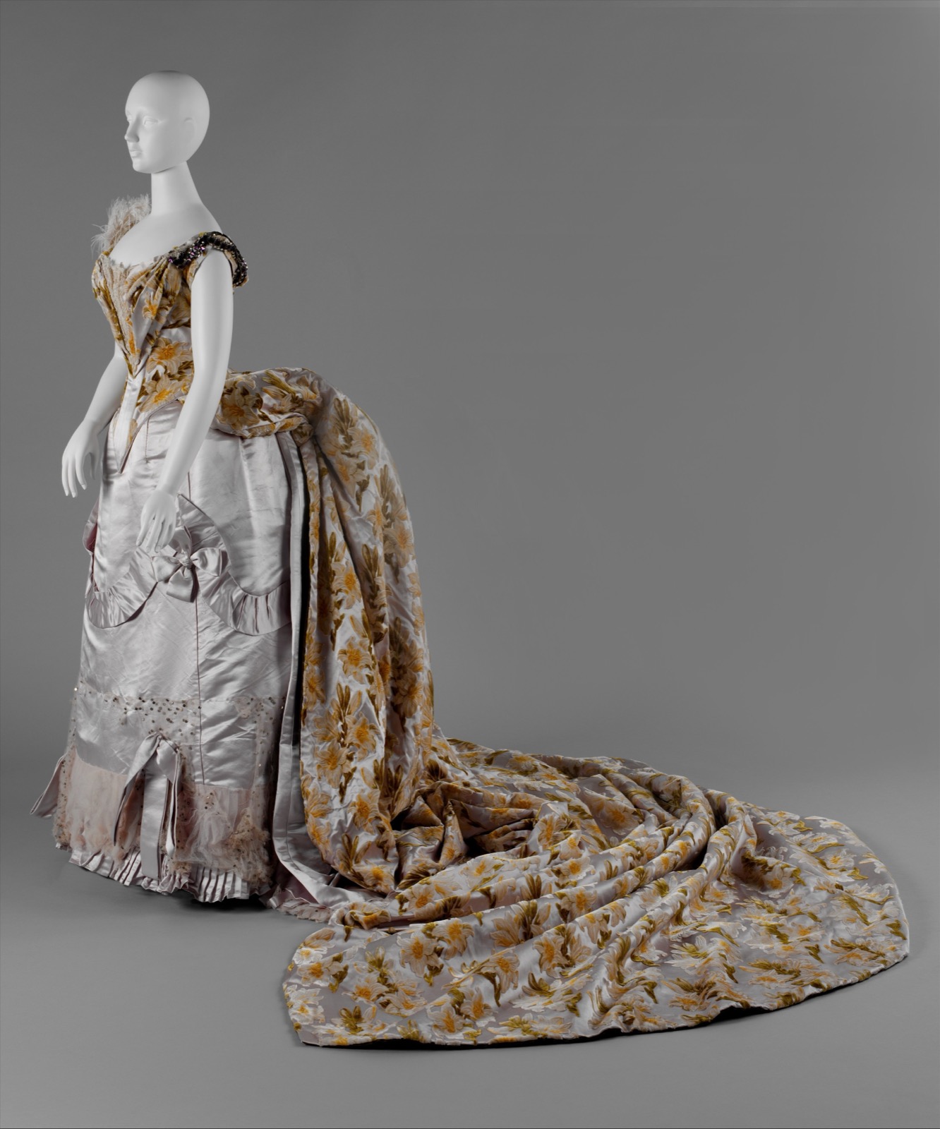 House of Worth court presentation ensemble with a long floral devoré silk-velvet train, shown on a mannequin