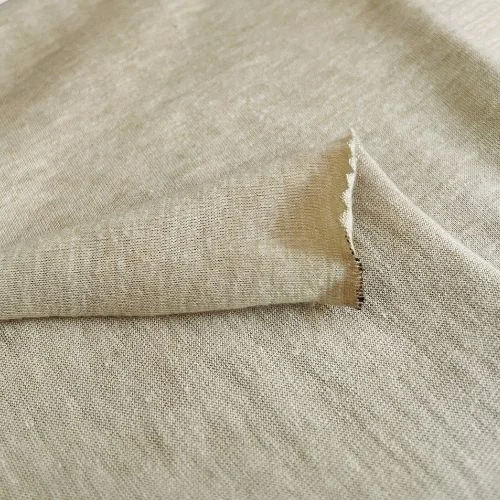 Folded beige single jersey swatch documented as a 65 percent polyester and 35 percent cotton blend